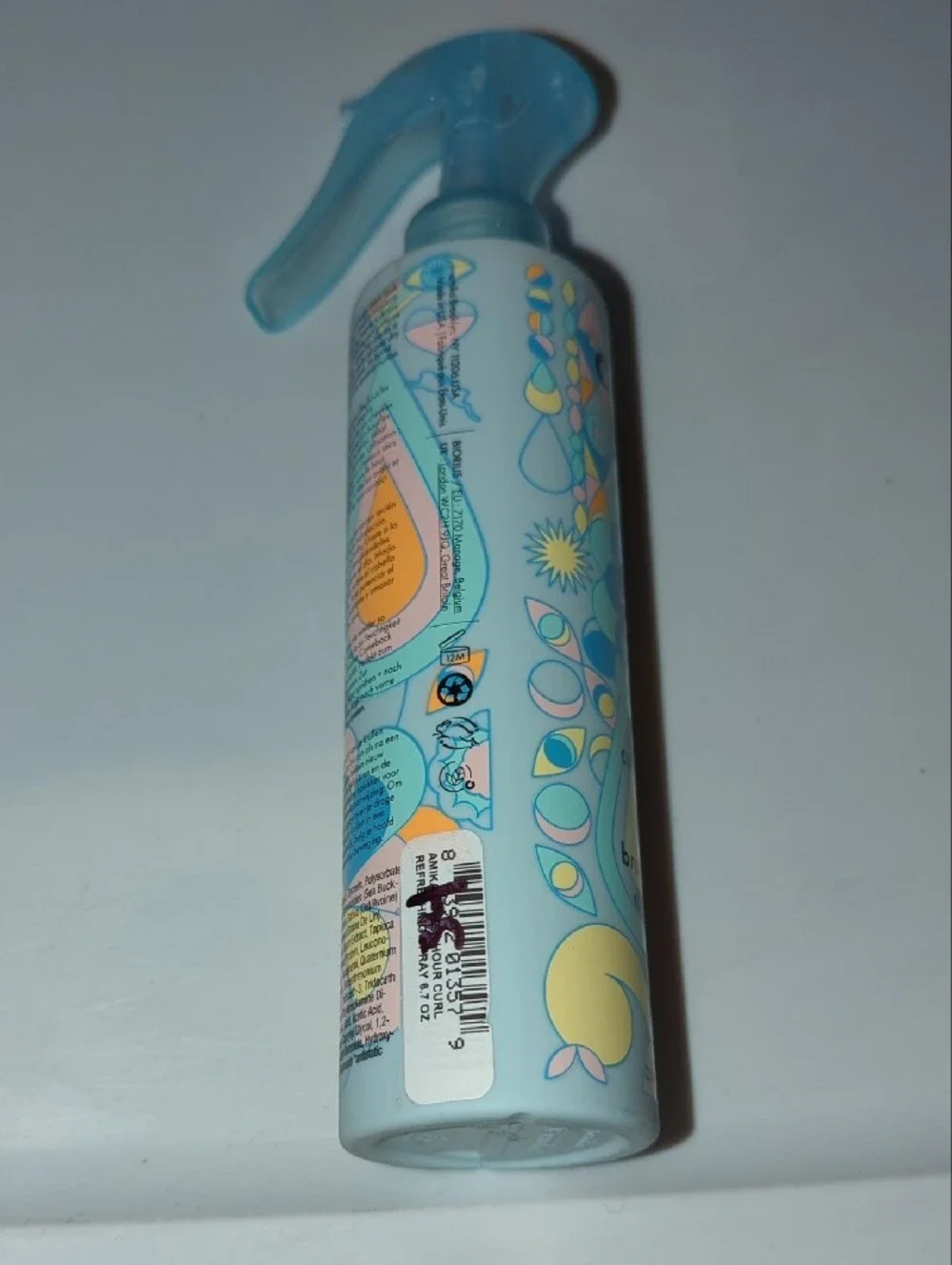 amika Refreshing Hair Spray in Light Blue and Pastel Peach